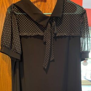 Adorable short sleeve black blouse with polka dots